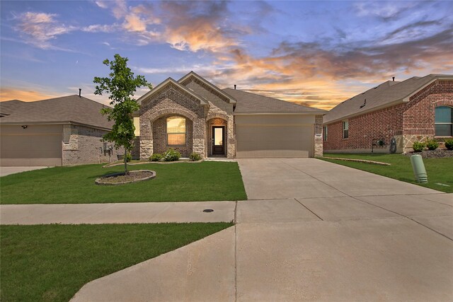 2560 Eden Creek Dr, Fort Worth, TX 76179 - view of front of house with brick siding, concrete driveway, an attached garage, and a front yard