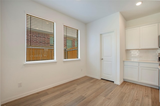 2560 Eden Creek Dr, Fort Worth, TX 76179 - unfurnished dining area with light wood-style flooring, baseboards, and recessed lighting
