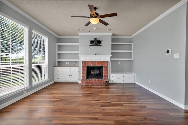 4504 Angelina Way, Fort Worth, TX 76137 - unfurnished living room featuring healthy amount of natural light, a textured ceiling, a ceiling fan, a fireplace, and built in shelves
