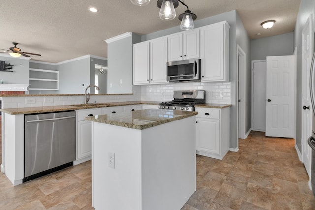 4504 Angelina Way, Fort Worth, TX 76137 - kitchen with stainless steel appliances, a sink, a textured ceiling, a ceiling fan, and light stone counters