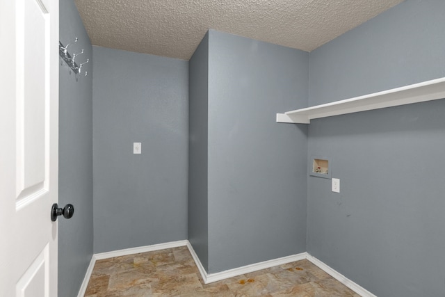 4504 Angelina Way, Fort Worth, TX 76137 - washroom with hookup for a washing machine, a textured ceiling, and baseboards