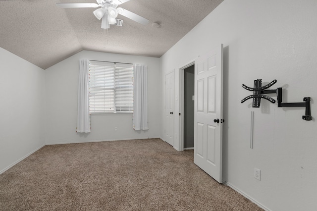 4504 Angelina Way, Fort Worth, TX 76137 - unfurnished bedroom with a textured ceiling, carpet flooring, lofted ceiling, ceiling fan, and baseboards