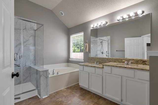 4504 Angelina Way, Fort Worth, TX 76137 - full bath with lofted ceiling, a marble finish shower, a bath, double vanity, and a textured ceiling