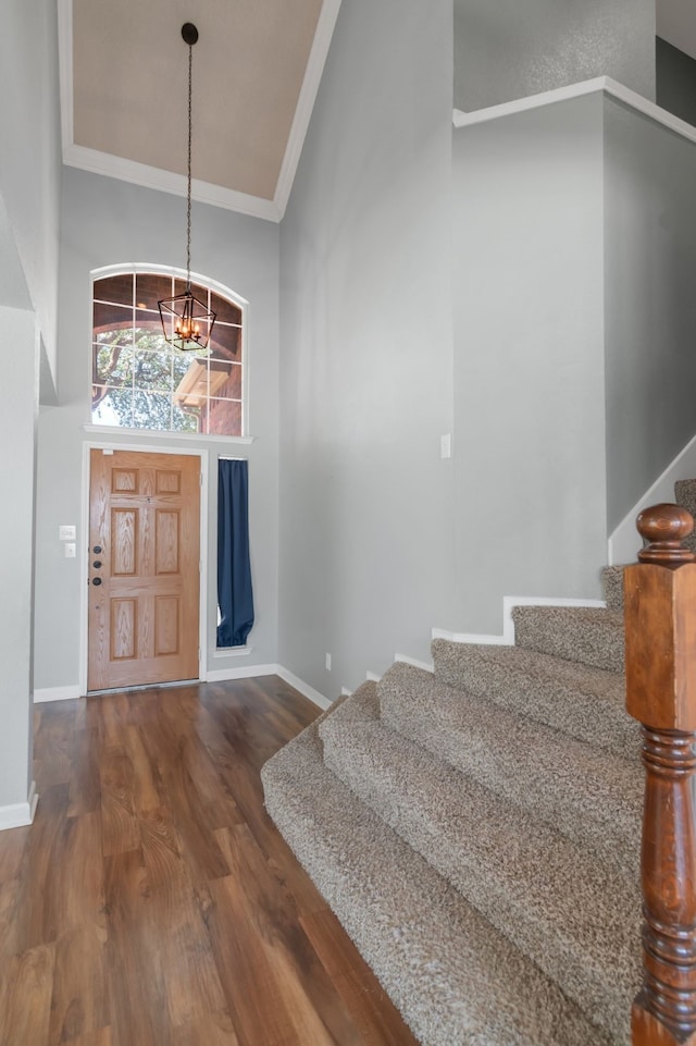 4504 Angelina Way, Fort Worth, TX 76137 - foyer featuring stairway, dark wood-style floors, a chandelier, ornamental molding, and a towering ceiling