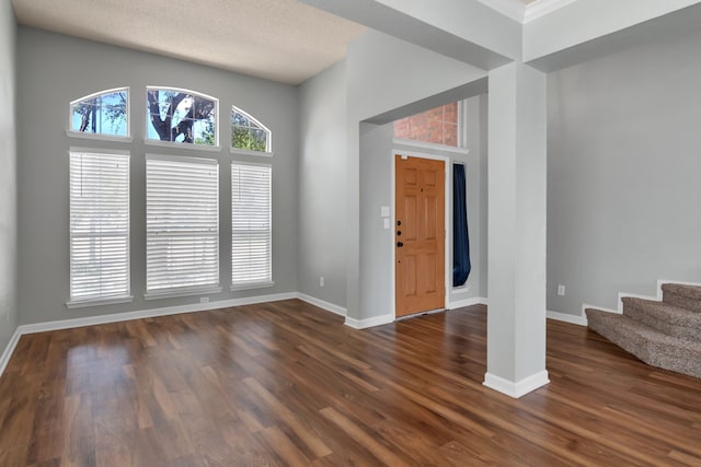 4504 Angelina Way, Fort Worth, TX 76137 - entrance foyer with dark wood finished floors, baseboards, stairs, and a towering ceiling