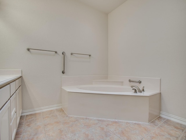 503 Hillcrest Ln, Krum, TX 76249 - bathroom featuring a bath, vanity, baseboards, and tile patterned flooring
