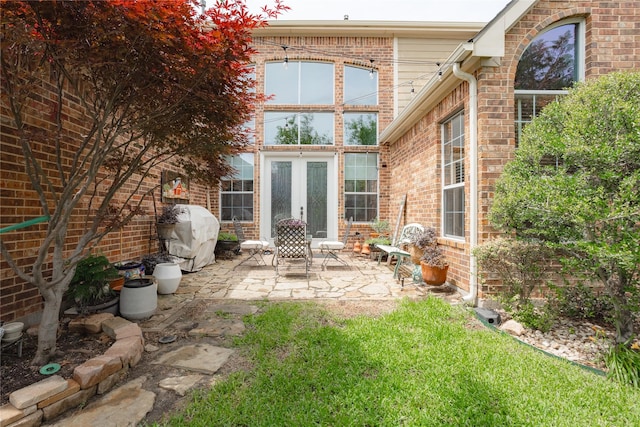 1217 Waterford Way, Allen, TX 75013 - rear view of property featuring a patio, brick siding, and french doors