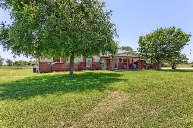 5295 Ganzer Rd W, Krum, TX 76249 - view of green lawn featuring covered porch