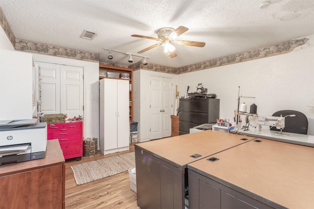 5295 Ganzer Rd W, Krum, TX 76249 - office with ceiling fan, a textured ceiling, light wood-style floors, and rail lighting