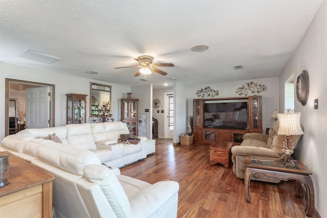 5295 Ganzer Rd W, Krum, TX 76249 - living area featuring a ceiling fan, a textured ceiling, and wood finished floors