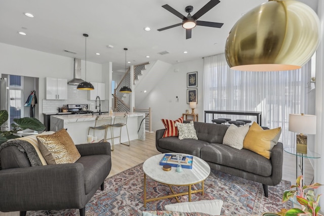 2102 N Prairie Ave Unit 105, Dallas, TX 75204 - living area with ceiling fan, light wood-style flooring, stairway, and recessed lighting