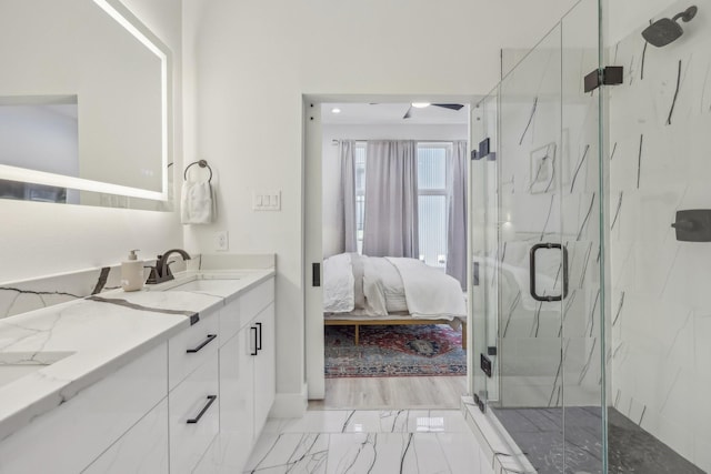 2102 N Prairie Ave Unit 105, Dallas, TX 75204 - full bathroom featuring ensuite bath, a marble finish shower, marble finish floors, and double vanity