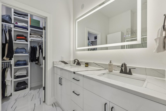 2102 N Prairie Ave Unit 105, Dallas, TX 75204 - full bath featuring marble look tile flooring, a walk in closet, and double vanity