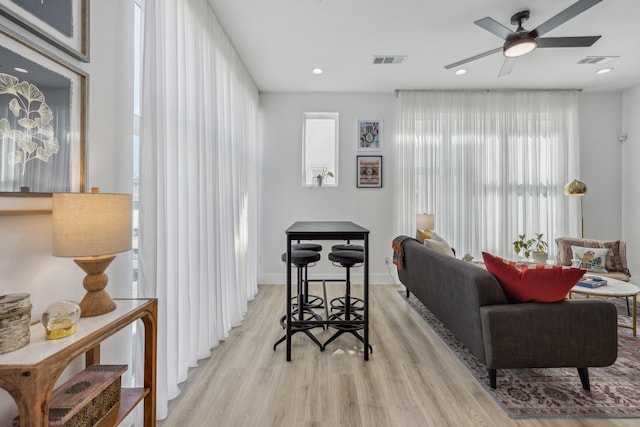 2102 N Prairie Ave Unit 105, Dallas, TX 75204 - living room with light wood-style floors, a ceiling fan, recessed lighting, and baseboards