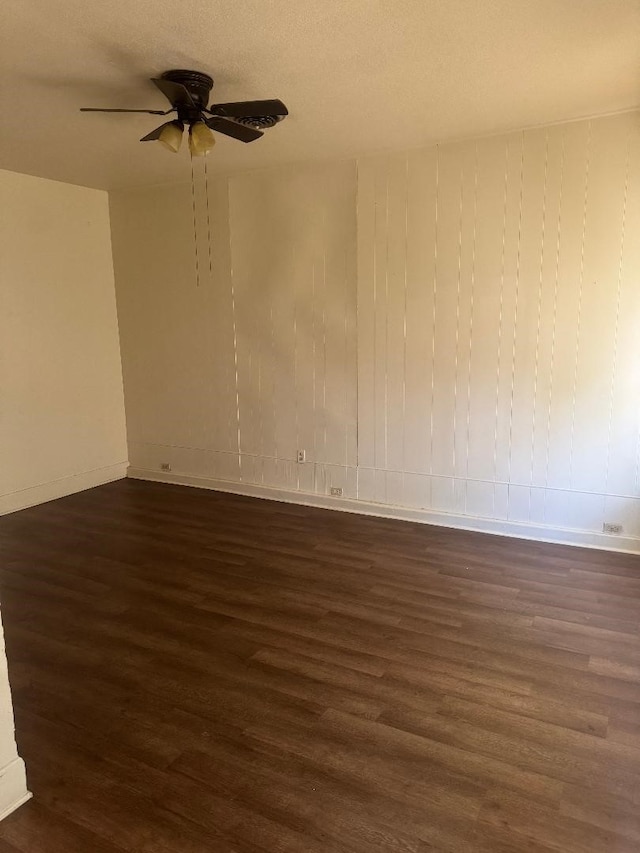 605 Merrick St, Shreveport, LA 71104 - spare room featuring dark wood-style flooring, ceiling fan, and baseboards