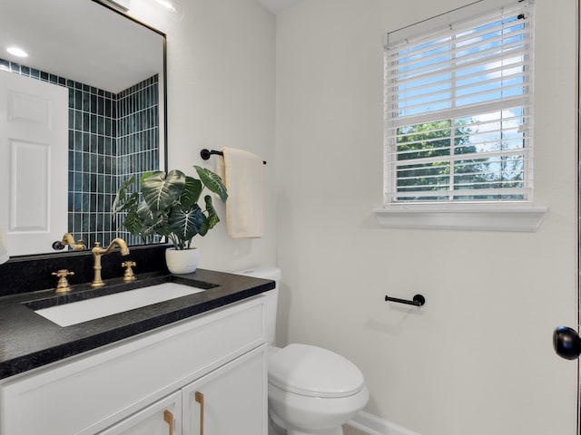 618 Berkley Dr, Grapevine, TX 76051 - bathroom featuring vanity, toilet, and baseboards
