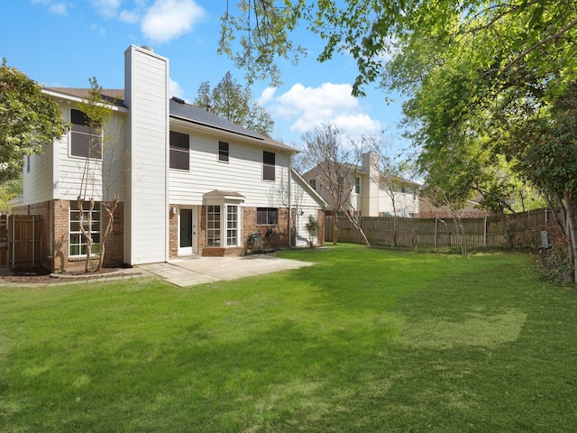 618 Berkley Dr, Grapevine, TX 76051 - rear view of house with brick siding, a patio area, and a chimney