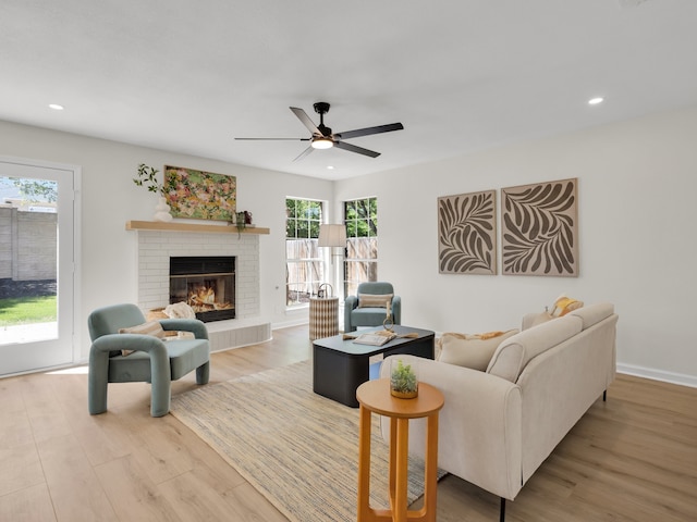 618 Berkley Dr, Grapevine, TX 76051 - living area with wood finished floors, ceiling fan, a fireplace, and recessed lighting