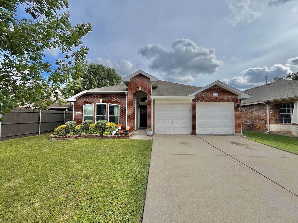 5805 Bridal Trl, Fort Worth, TX 76179 - view of front facade featuring brick siding, an attached garage, concrete driveway, and a shingled roof