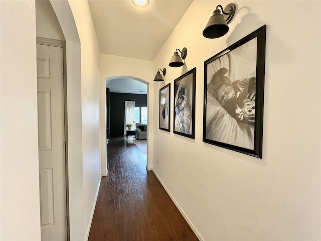 5805 Bridal Trl, Fort Worth, TX 76179 - hall with arched walkways, dark wood-type flooring, and baseboards
