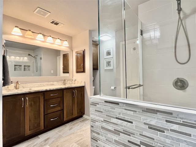 5805 Bridal Trl, Fort Worth, TX 76179 - bathroom featuring a stall shower, double vanity, and toilet