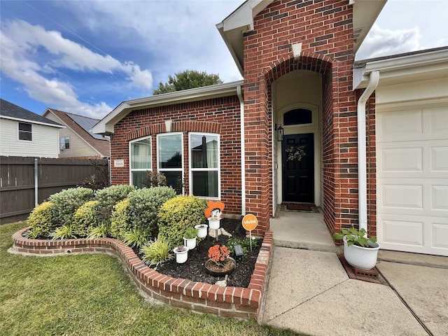 5805 Bridal Trl, Fort Worth, TX 76179 - doorway to property with fence, brick siding, and a garage