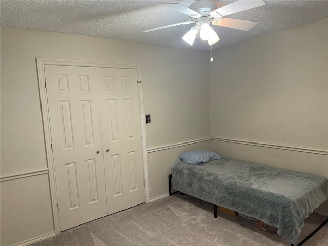 4809 Westhaven Rd, Arlington, TX 76017 - carpeted bedroom featuring a ceiling fan, a textured ceiling, and a closet