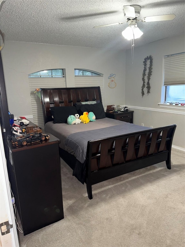 4809 Westhaven Rd, Arlington, TX 76017 - bedroom with light carpet, a textured ceiling, and a ceiling fan