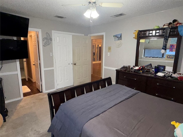 4809 Westhaven Rd, Arlington, TX 76017 - carpeted bedroom with a textured ceiling and a ceiling fan