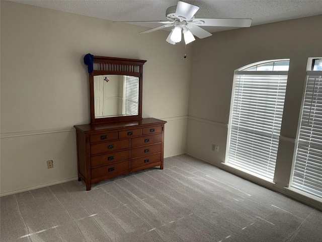 4809 Westhaven Rd, Arlington, TX 76017 - unfurnished bedroom featuring a textured ceiling, carpet floors, and a ceiling fan