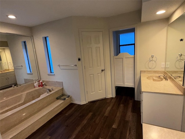 4809 Westhaven Rd, Arlington, TX 76017 - full bath with wood finished floors, two vanities, a garden tub, and recessed lighting
