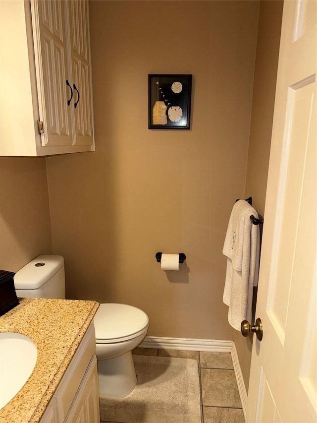 4809 Westhaven Rd, Arlington, TX 76017 - bathroom featuring toilet, baseboards, tile patterned floors, and vanity