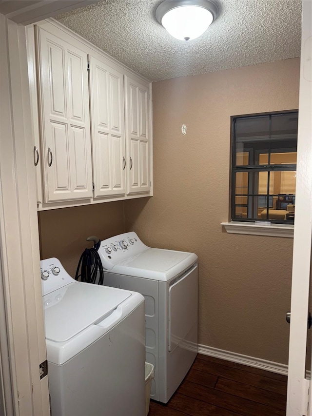 4809 Westhaven Rd, Arlington, TX 76017 - clothes washing area with cabinet space, washer and dryer, dark wood-type flooring, baseboards, and a textured ceiling