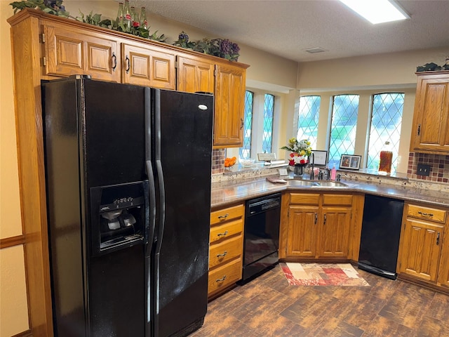 4809 Westhaven Rd, Arlington, TX 76017 - kitchen with black appliances, dark wood finished floors, backsplash, and brown cabinetry