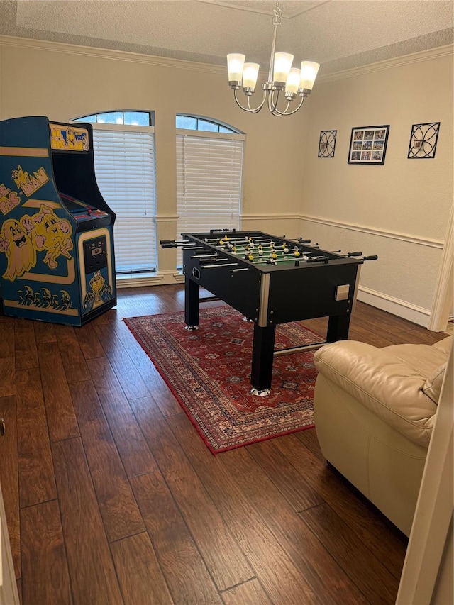 4809 Westhaven Rd, Arlington, TX 76017 - rec room with hardwood / wood-style flooring, a textured ceiling, a chandelier, and ornamental molding