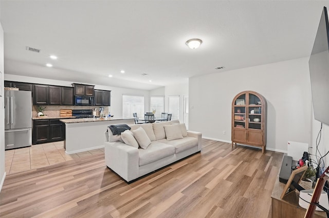 737 Walls Blvd, Crowley, TX 76036 - living room with light wood finished floors, recessed lighting, and baseboards