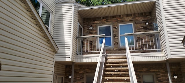 7340 Skillman St Unit 512, Dallas, TX 75231 - view of side of home featuring brick siding and a balcony