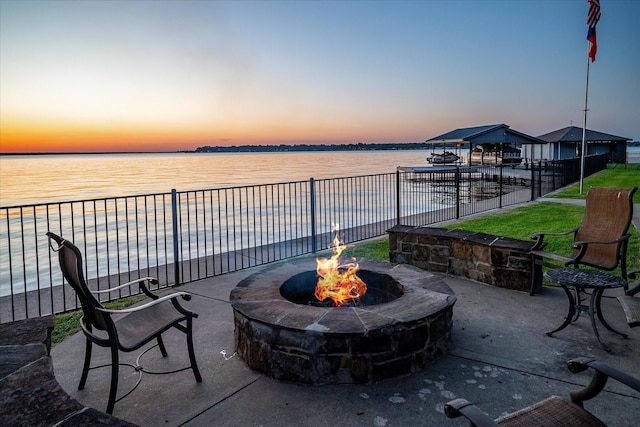 278 Shady Shores Dr, Mabank, TX 75156 - patio terrace at dusk with a water view, an outdoor fire pit, and fence