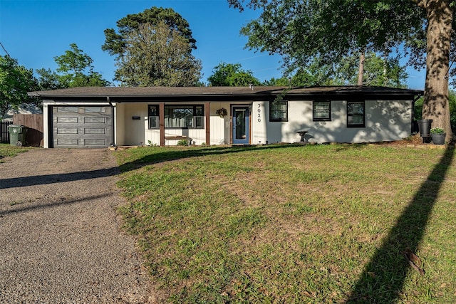 3020 Meadowlark, Tyler, TX 75701 - ranch-style home with dirt driveway, a garage, and a front lawn
