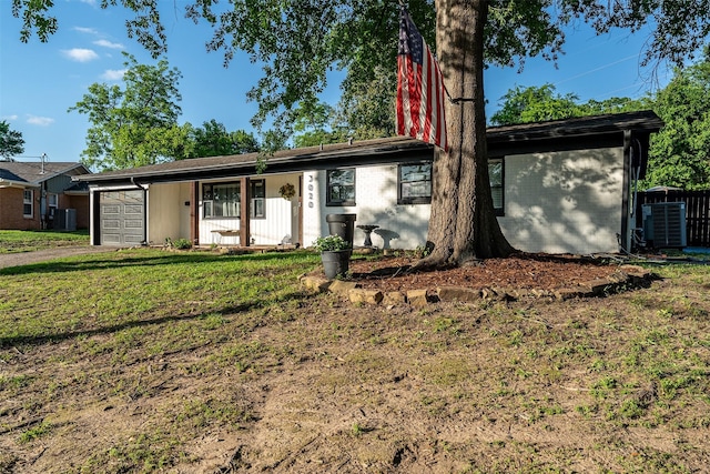 3020 Meadowlark, Tyler, TX 75701 - single story home featuring an attached garage, cooling unit, a front yard, and driveway