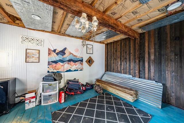 3020 Meadowlark, Tyler, TX 75701 - living area featuring wooden walls, wood-type flooring, and a chandelier