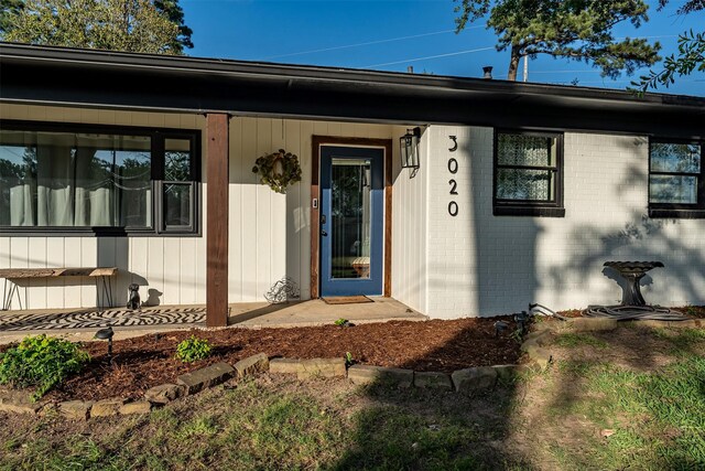 3020 Meadowlark, Tyler, TX 75701 - entrance to property featuring brick siding and a porch