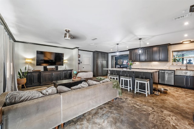 3020 Meadowlark, Tyler, TX 75701 - living area featuring crown molding and recessed lighting