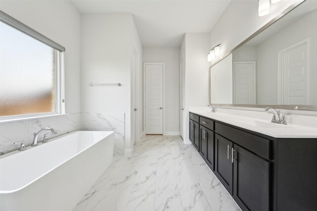 6322 Farndon Dr, Celina, TX 76227 - full bathroom with a soaking tub, double vanity, and marble look tile flooring