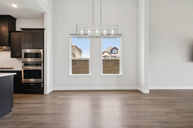 6322 Farndon Dr, Celina, TX 76227 - unfurnished dining area with a chandelier, wood finished floors, and recessed lighting