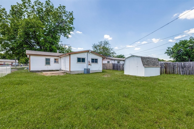 5241 E Berry St, Fort Worth, TX 76119 - back of house featuring a storage unit, an outbuilding, and central air condition unit