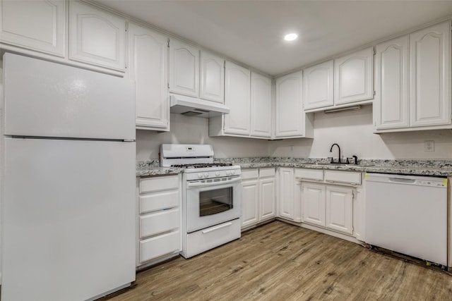 5241 E Berry St, Fort Worth, TX 76119 - kitchen featuring white appliances, under cabinet range hood, light wood-style floors, a sink, and white cabinetry