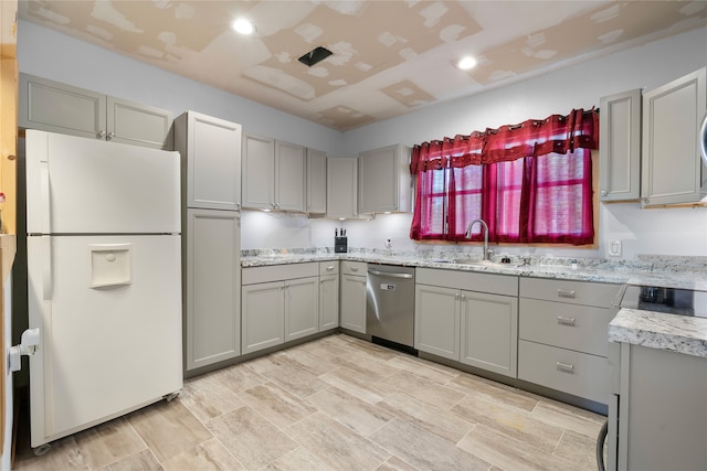 442 W Mccart St, Krum, TX 76249 - kitchen featuring white refrigerator with ice dispenser, dishwasher, a sink, gray cabinetry, and recessed lighting