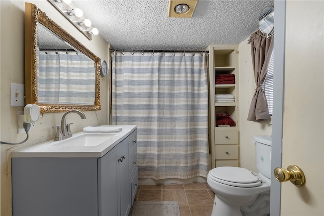 442 W Mccart St, Krum, TX 76249 - full bathroom featuring a textured ceiling, toilet, vanity, tile patterned floors, and a shower with curtain