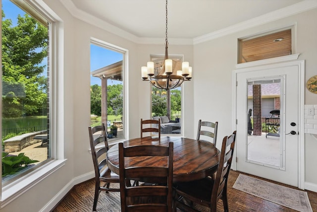 528 Layton Dr, Coppell, TX 75019 - dining room featuring a chandelier, crown molding, wood finished floors, and baseboards